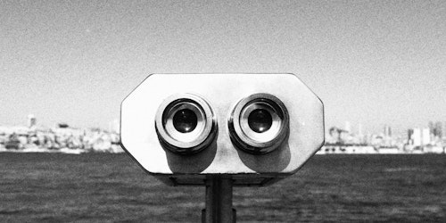 A black-and-white photograph of a binocular-style viewfinder A black-and-white photograph of a binocular-style viewfinder