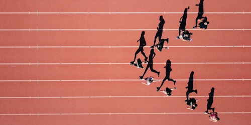 Runners on a track, in an arrow formation Runners on a track, in an arrow formation